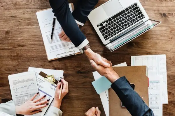 Case Study - Men shaking hands after a business meeting